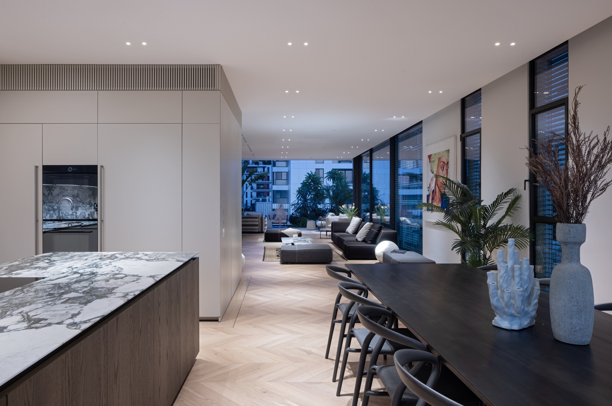 Modern commercial ceiling lighting installation showcasing minimalist recessed spotlights designed for glare-free, high-end illumination in a large commercial facility or showroom lobby.