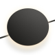 UMWR2007 black circular wall sconce emitting 360° ambient light in a luxury modern bedroom.