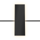 UMWS2005 black 48V rectangular wall sconce providing 360° ambient glow in a contemporary hotel bedroom.